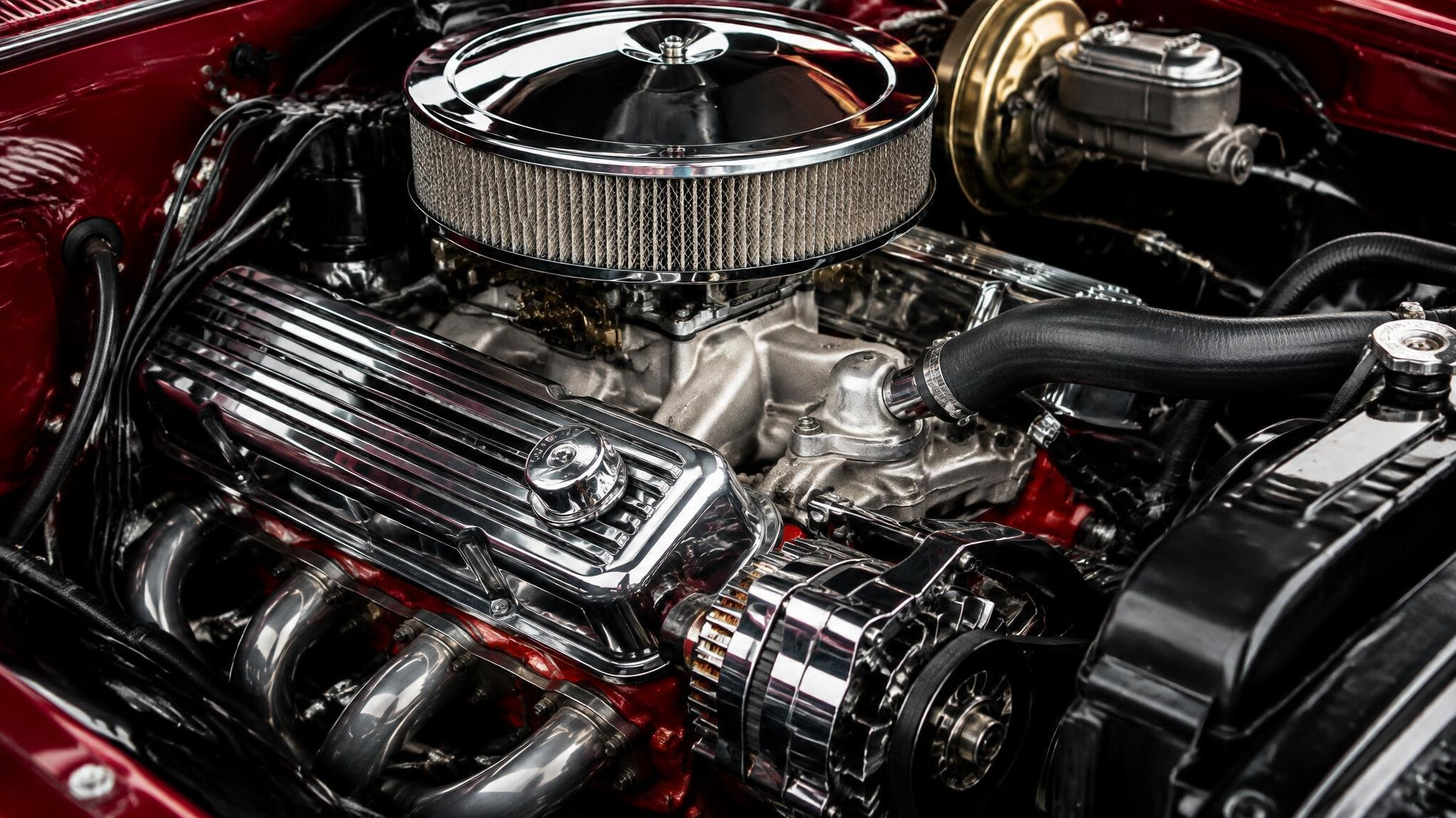 Detailed close-up of a vintage chrome automobile engine bay