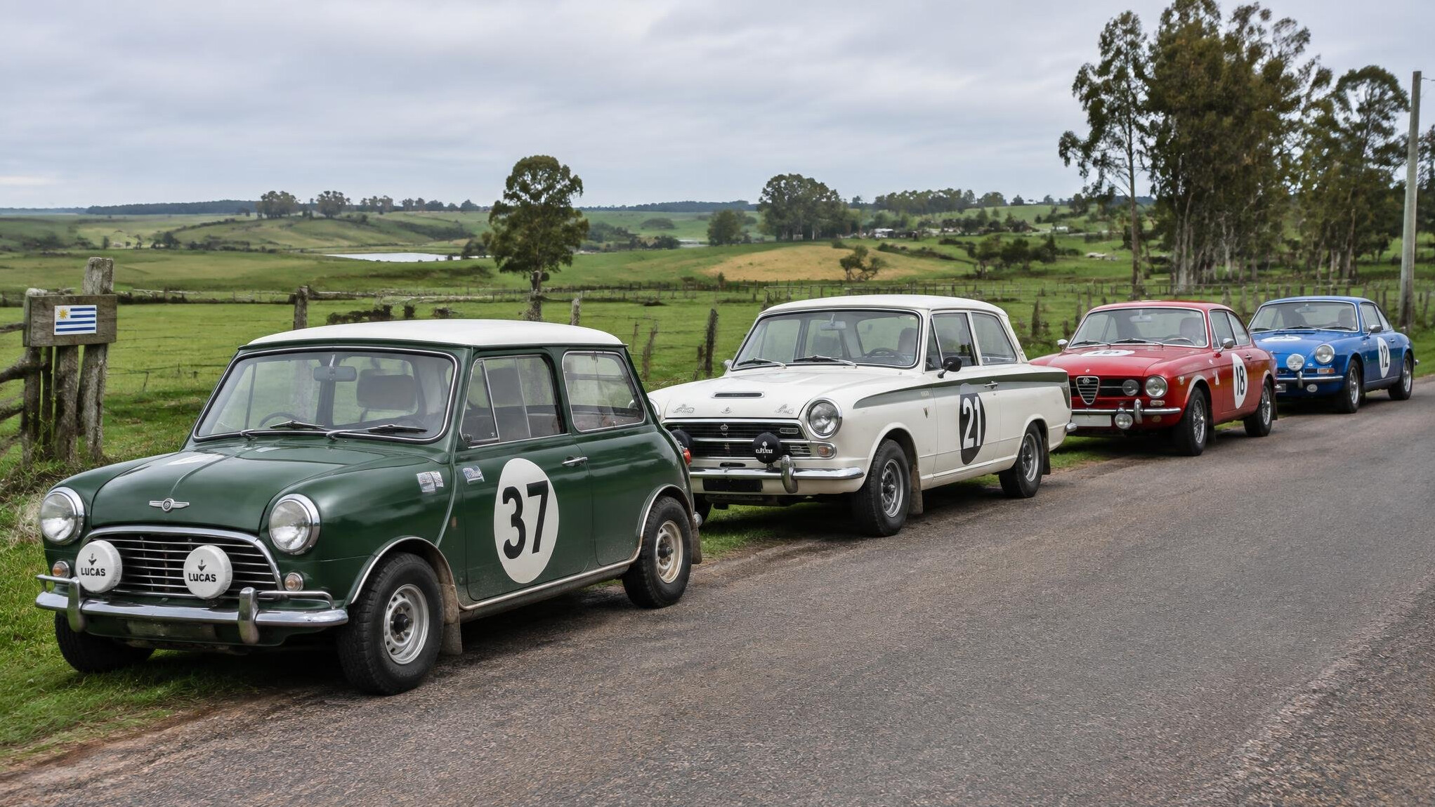 Row of classic rally cars parked on a rural road in Canelones Uruguay