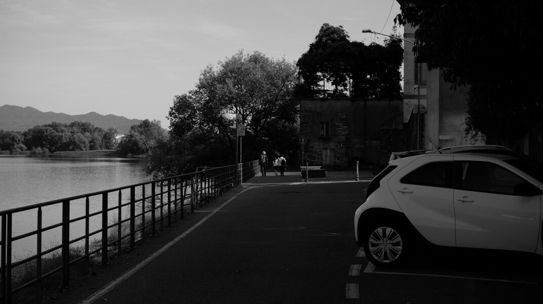 luxury car parked by lake